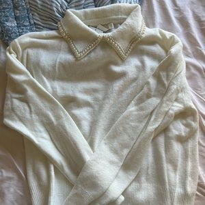 White long sleeve sweater, comfy and non itchy.